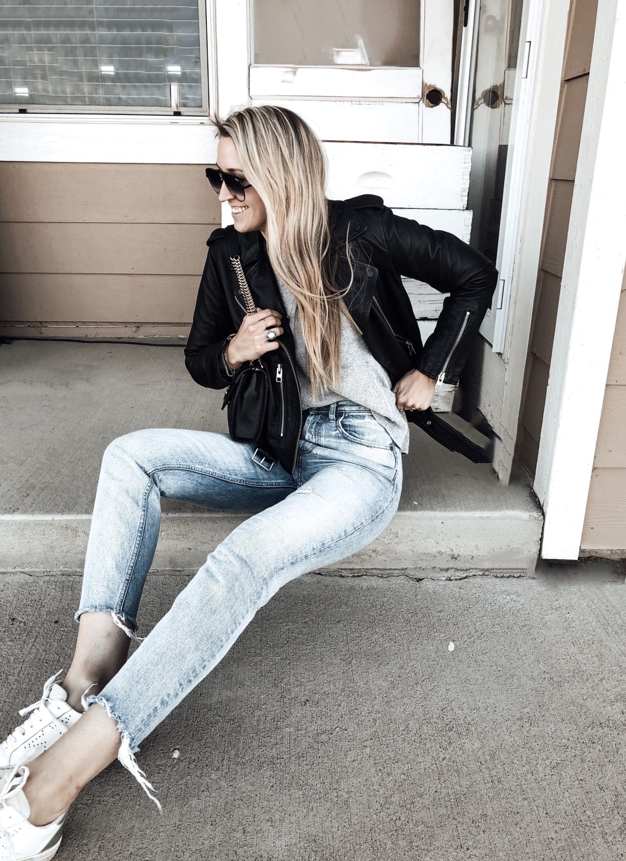 Leather Jacket Styled with Sweater, Jeans, and Sneakers