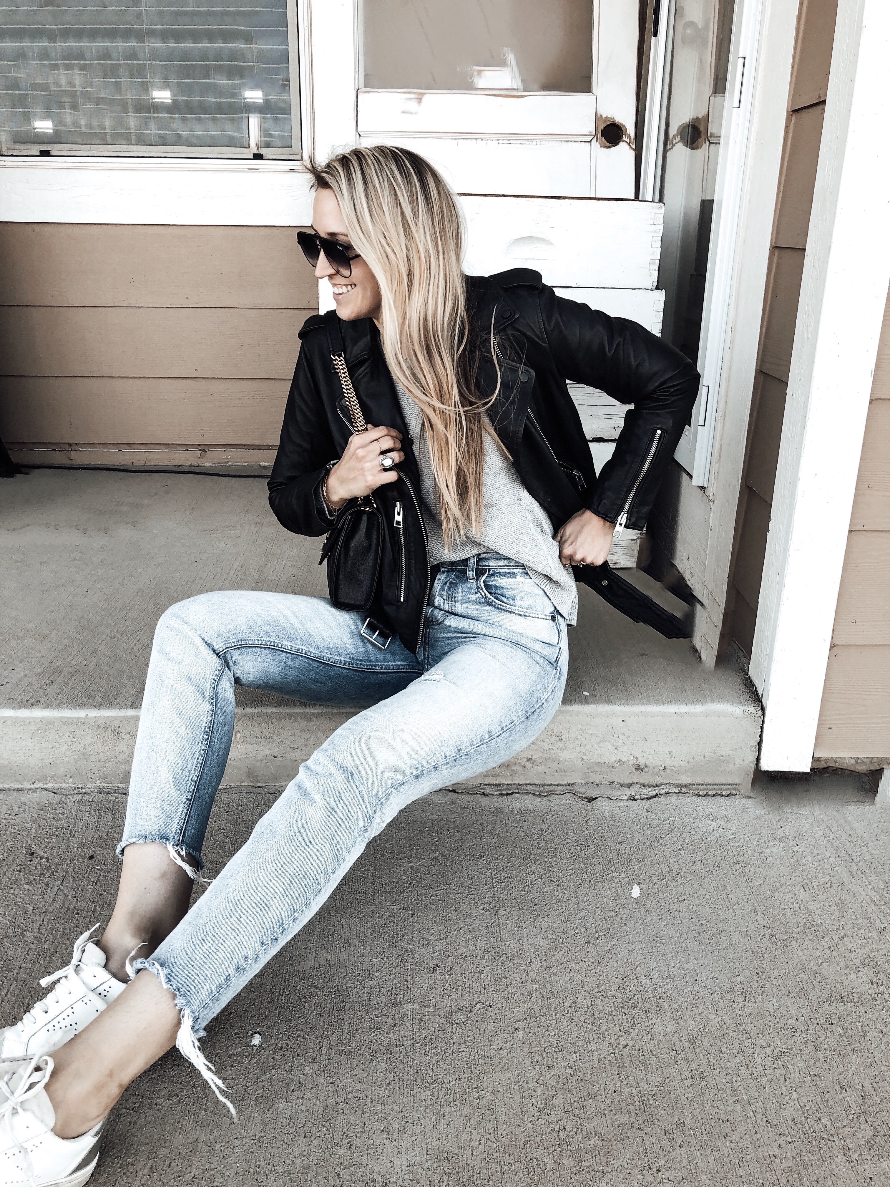 Leather Jacket Styled with Sweater, Jeans, and Sneakers